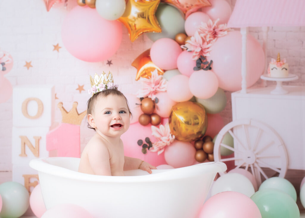 Bubble bath finale with birthday girl laughing in pastel-themed setup