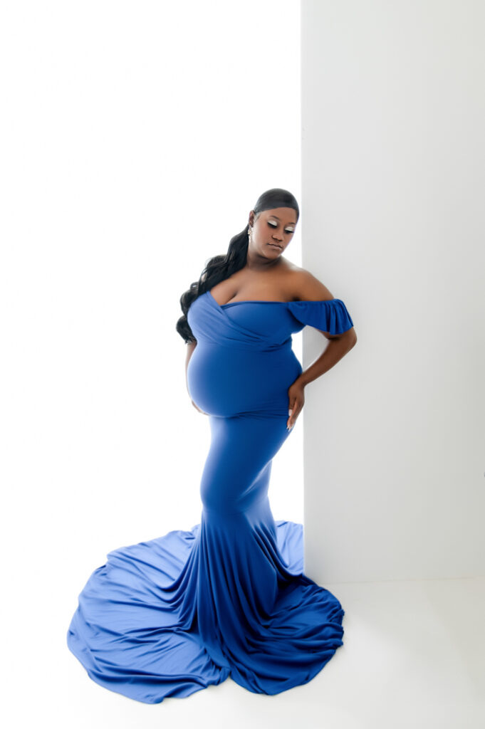 Studio maternity photo in bold blue gown, Misty Dawn Photography in Birmingham, AL.