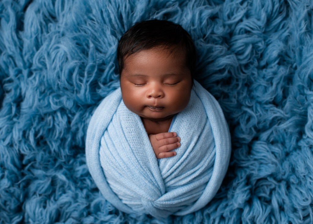 boy baby photo wrapped in light blue and gorgeous blue fur