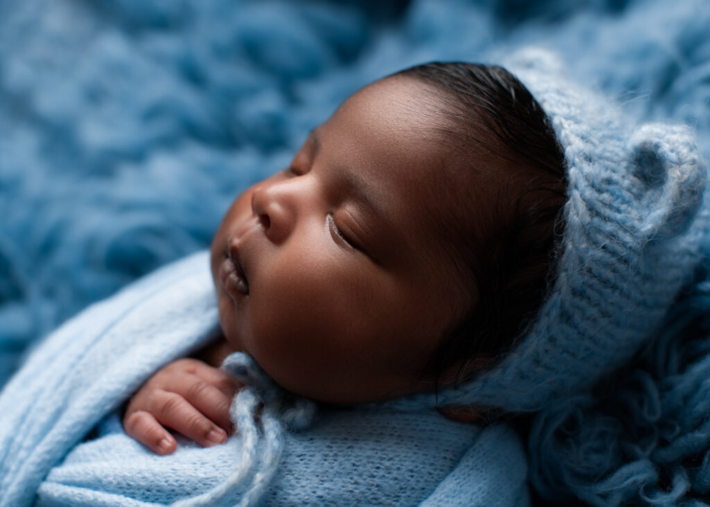 boy baby photo wrapped in light blue and gorgeous blue fur