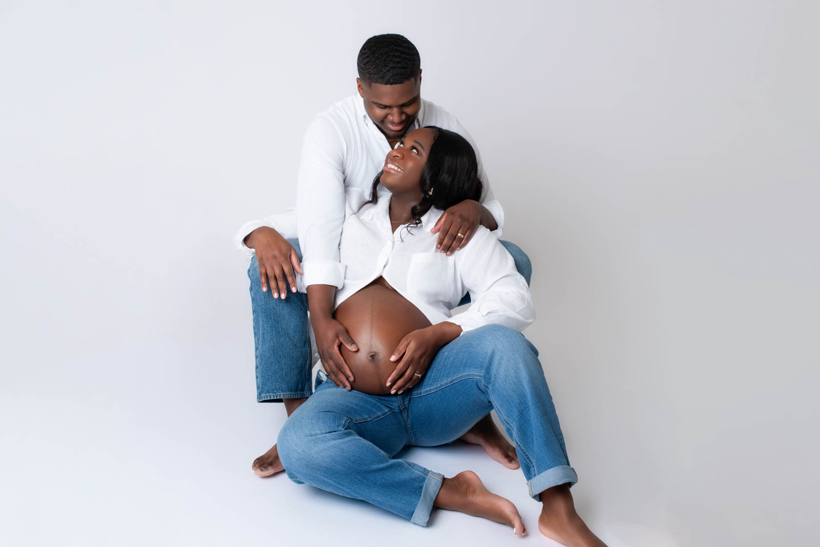 Expecting couple posing together during their Birmingham maternity photo session