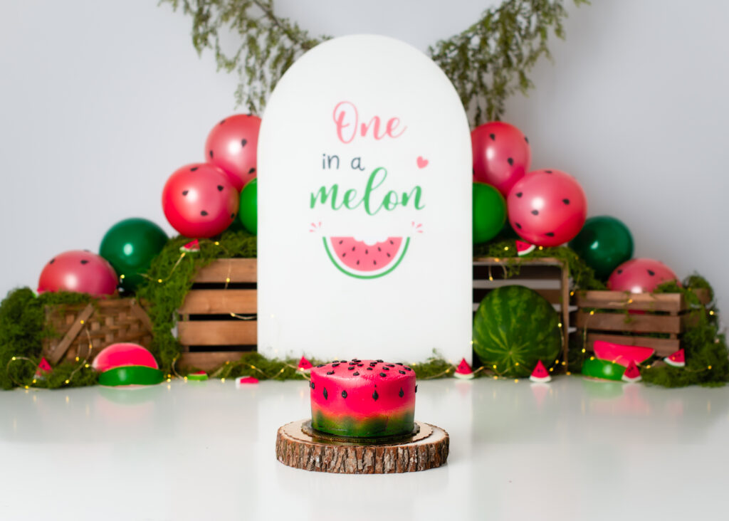 One in Melon cake smash themed studio set up for babies turning one