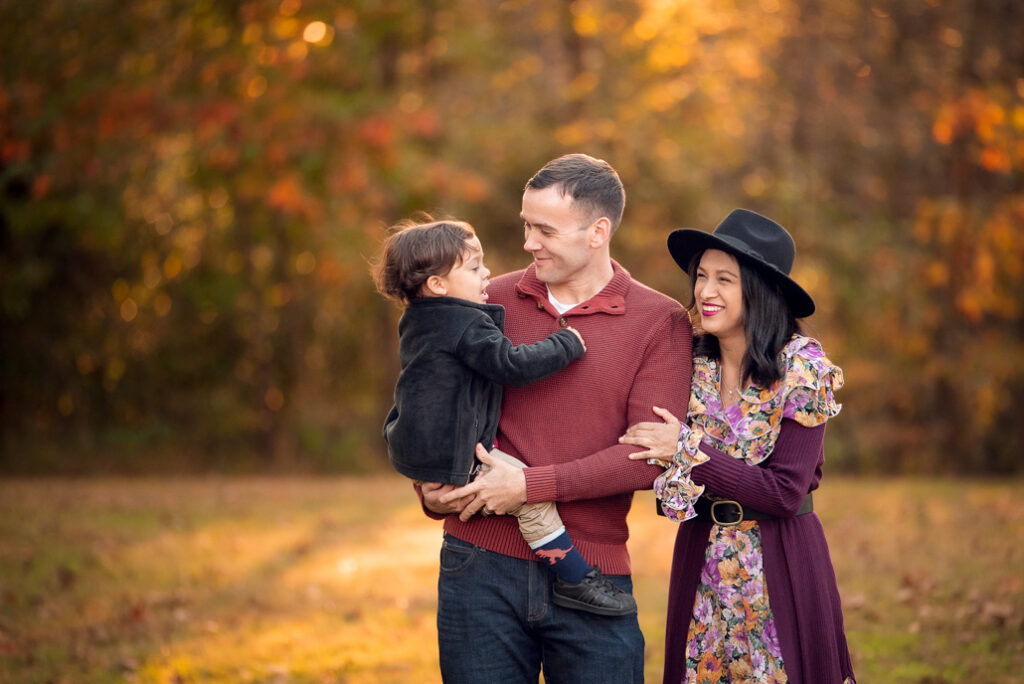 Fall family photo outfits Birmingham with a full family group in layered outfits