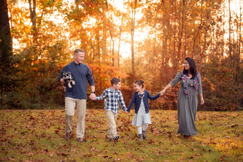 Fall family photo outfits Birmingham with a full family group in complementary fall tones.