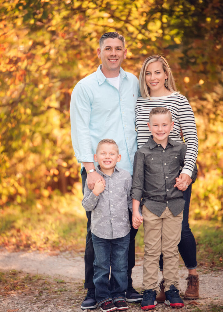 Fall family photo outfits Birmingham with parents and children in gray and neutral tones.