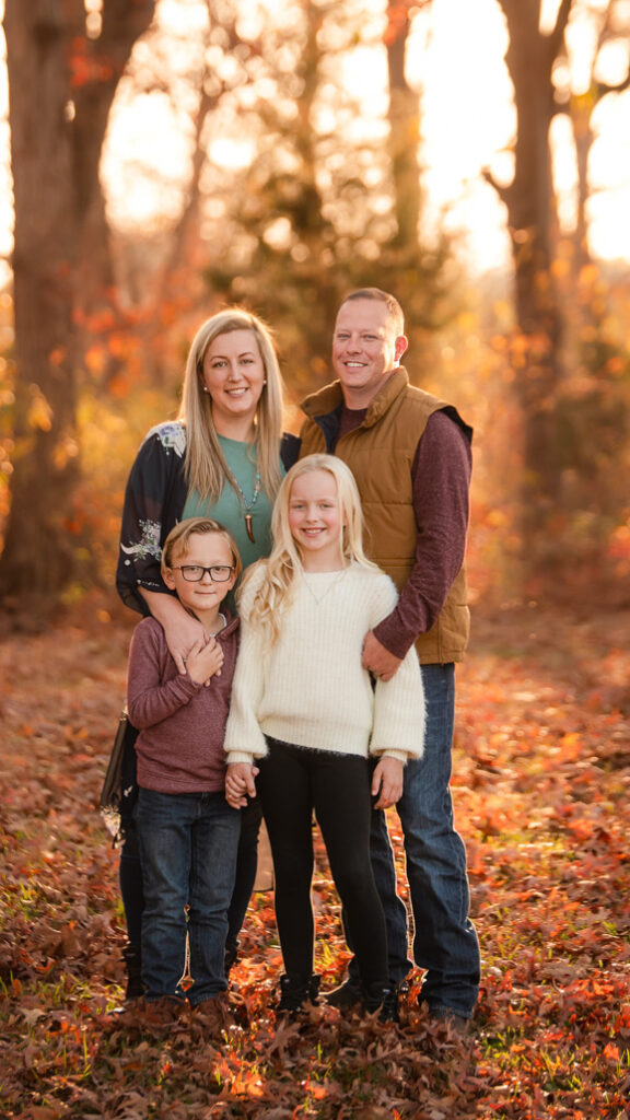 Fall family photo outfits Birmingham with family in cream knitwear and denim.