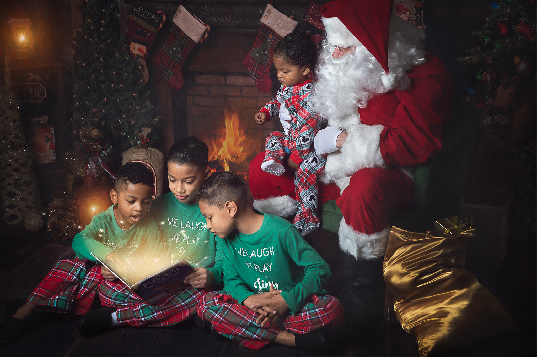Children listening to Santa read a Christmas story in a warm holiday studio set in Birmingham, Alabama.
